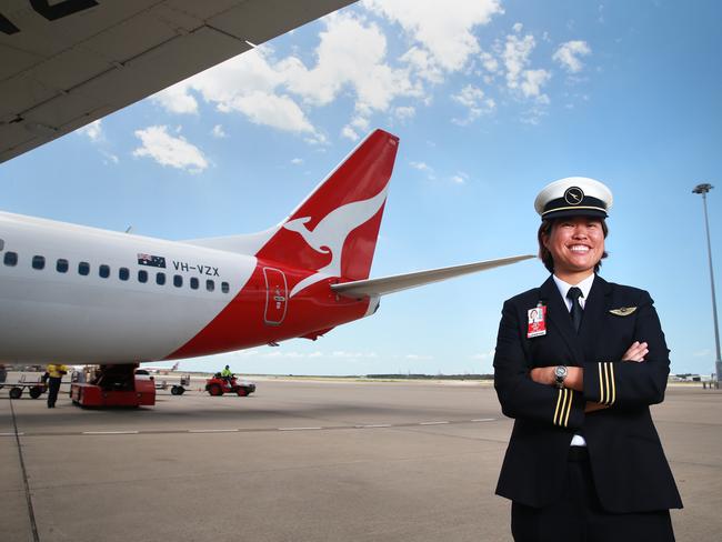 First Officer Boeing 737-800 Haidee Wong poses on the tarmac at Brisbane Airport. QANTAS is hosting the first of a series of training days for women, kicking off in Brisbane as it seeks to address a looming pilot shortage.Photo: Claudia Baxter