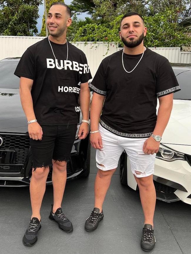 Haissam Hamzy and Ibrahem Hamze show no fear about the state of the current feud with the rival Alameddine clan as they pose in front of luxury cars. Picture: Facebook