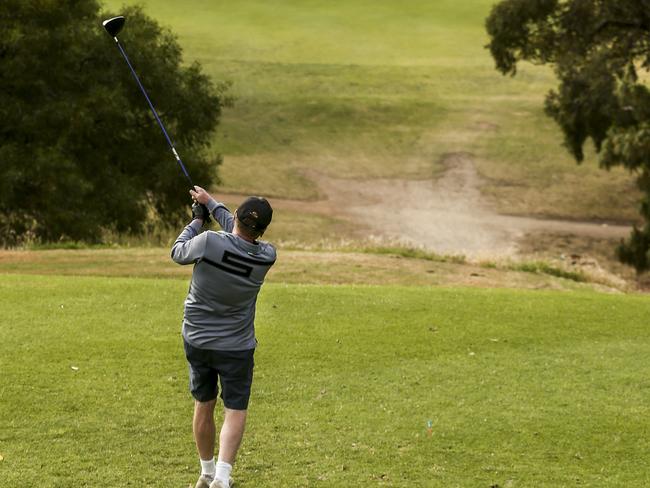 HOT WEATHER PHOTO - regular golfers tee off on the third hole at North Adelaide Golf Course, Friday, November 10, 2017 (overcast 23degrees at 7.35) - pic AAP/MIKE BURTON