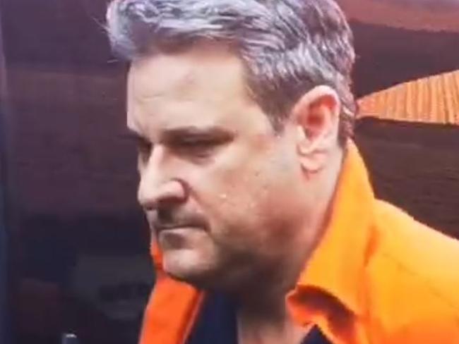 Troy Smith facing drug charges in Bali is escorted to hospital today . Picture:  Komang Erviani