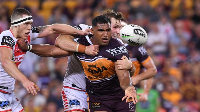 Tevita Pangai of the Broncos offloads the ball in a tackle during the Round 3 NRL match between the Brisbane Broncos and St George Illawarra Dragons at Suncorp Stadium in Brisbane, Thursday, March 28, 2019. (AAP Image/Dave Hunt) NO ARCHIVING, EDITORIAL USE ONLY