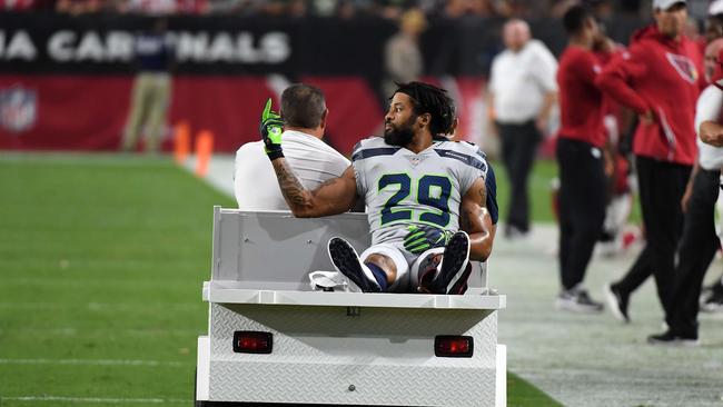 Defensive back Earl Thomas #29 of the Seattle Seahawks gestures as he leaves the field on a cart after being injured during the fourth quarter against the Arizona Cardinals. Picture: Getty Images