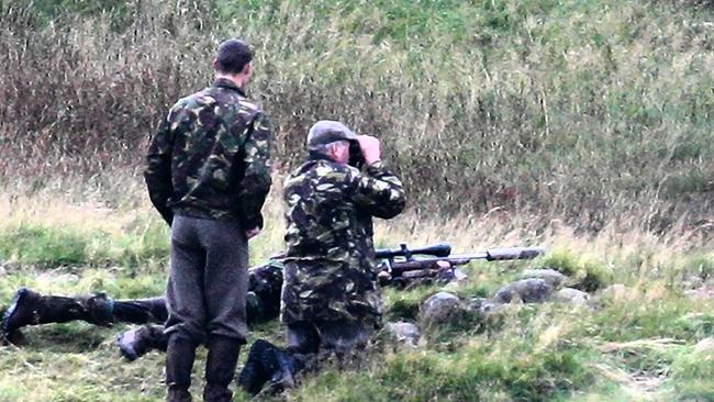 Kate Middleton hunting on the royals' Balmoral Estate. Kate takes aim from a prone position.