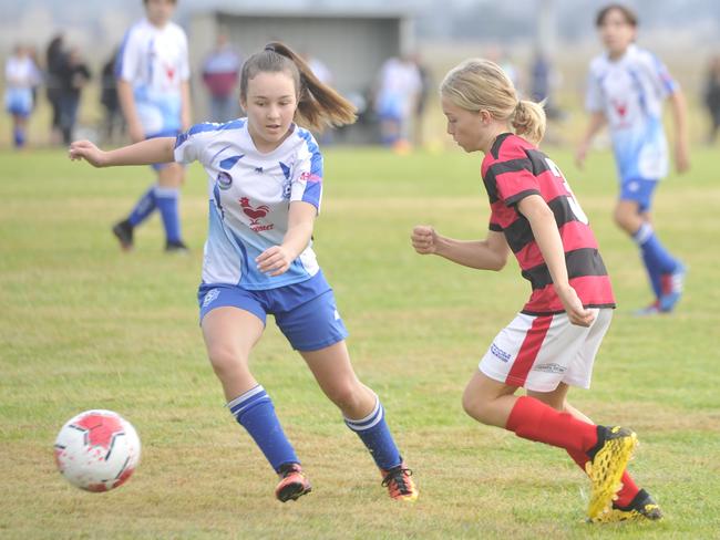 Grafton City Blitz (white) take on Yuraygir Bears (red and black) in the North Coast Football CL 14s at Rushforth Park on Saturday, July 11, 2020. Photo: Mitchell Keenan