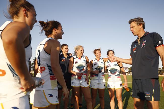 Adelaide head coach Matthew Clarke speaks to his players after the Round 7 AFLW match against the Melbourne Demons.