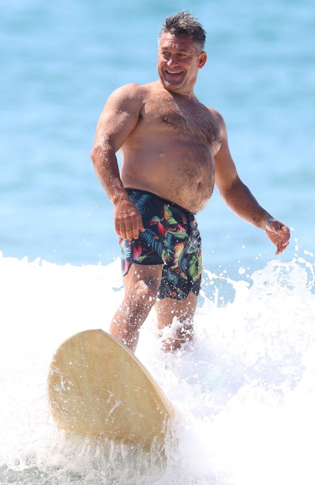 Jamie Durie hits the waves at a Sydney beach on November 24. Picture: BACKGRID