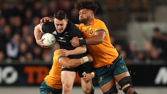 Will Jordan is tackled by Rob Valetini. Picture: Phil Walter/Getty Images