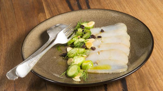 Orange and coriander seed cured king fish with cucumber, currants, almonds and green chilli oil at Bistro Lola. Picture: Rob Leeson