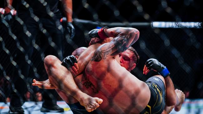 Brian Ortega holds Alexander Volkanovski in a leg lock. Picture: Getty