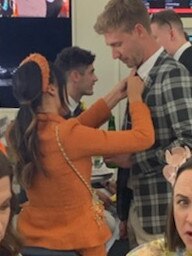 Tayla Damir and Nathan Broad getting flirty at the Melbourne Cup.