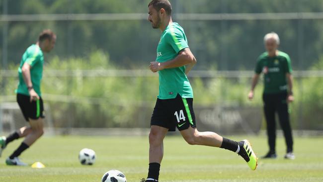 James Troisi is watched closely by Bert van Marwijk.