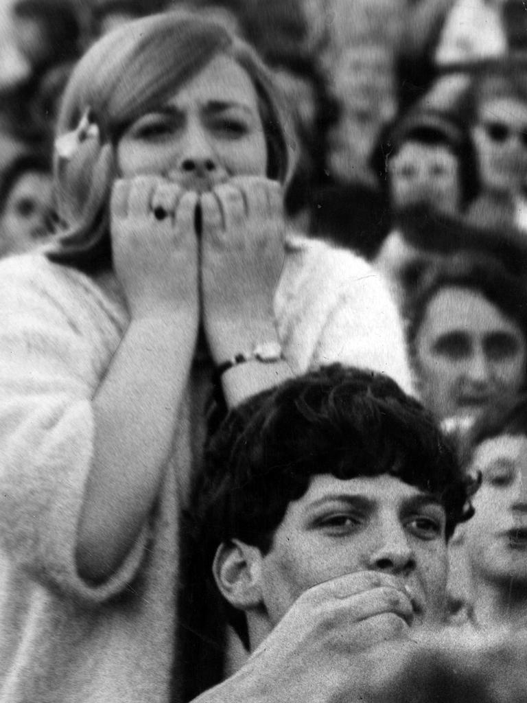 Nervous fans watch the closing seconds of the match.