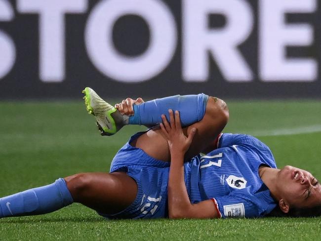 France's defender #13 Selma Bacha reacts on the ground during the Australia and New Zealand 2023 Women's World Cup round of 16 football match between France and Morocco at Hindmarsh Stadium in Adelaide on August 8, 2023. (Photo by FRANCK FIFE / AFP)