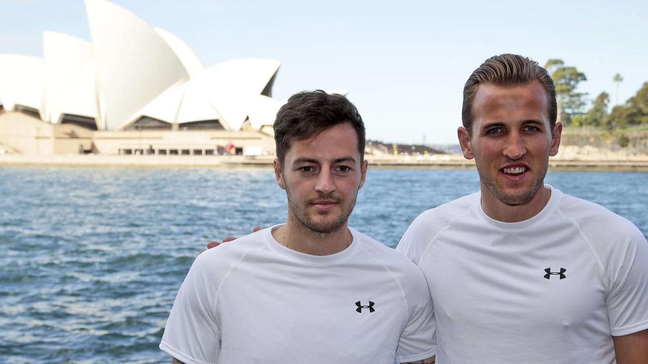 Tottenham Hotspur's Young Player of the Year Harry Kane, left, and Ryan Mason pose for a photo in front of Sydney Opera House after a media conference in Sydney Thursday, May 28, 2015. Tottenham Hotspur will play against the Sydney FC in their friendly soccer match on May 30, 2015 at Sydney Olympic Park. (AP Photo/Rob Griffith)