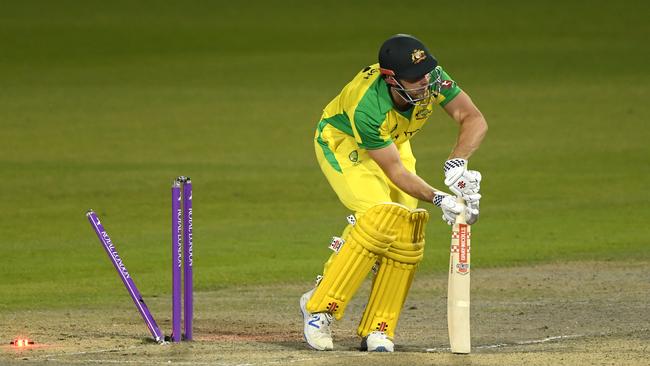 Mitchell Marsh is bowled by Jofra Archer during the second ODI at Old Trafford. The Australian players are on the other side of the world while a storm brews at home