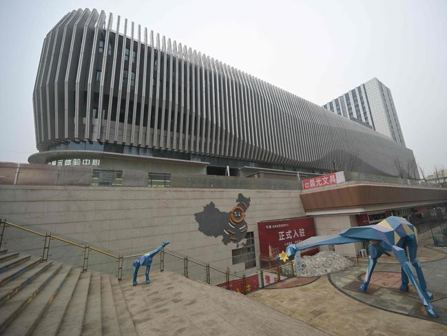 A general view shows the entrance of a partially operating Evergrande commercial complex in Beijing on January 30, 2024. A Hong Kong court on January 29 ordered the liquidation of China's property giant Evergrande, but the firm said it would continue to operate in a case that has become a symbol of the nation's deepening economic woes. (Photo by Pedro PARDO / AFP)