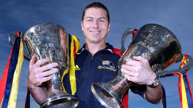 Crows dual-premiership captain Mark Bickley with the 1997 and 1998 cups.