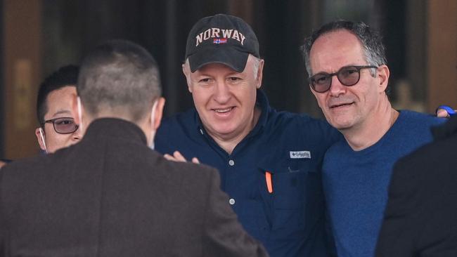 WHO team members Peter Daszak, second from right, and Peter Ben Embarek, right, pose for a picture as Daszak leaves their hotel in Wuhan after the investigation. Picture: AFP