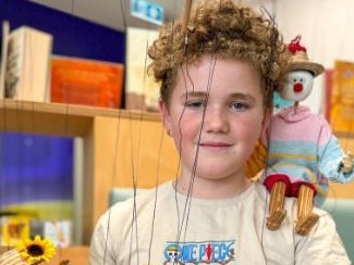 On his first day out of his hospital bed, Landen found he was a natural at marionette puppetry. Picture: Supplied