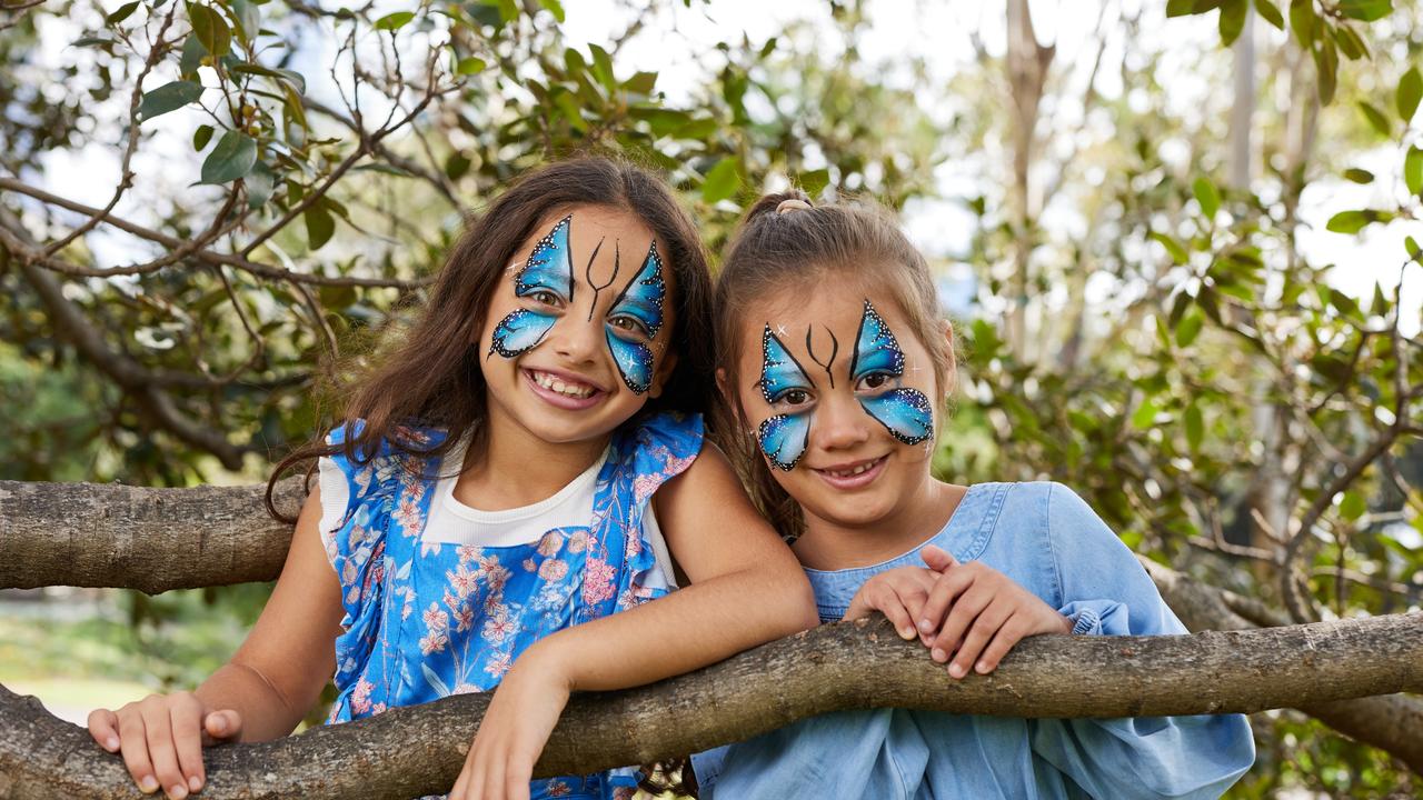 Mila, pictured at right, with Lucy, both seven, channel the Ulysses butterfly. Picture: Australia Post/David Swift.