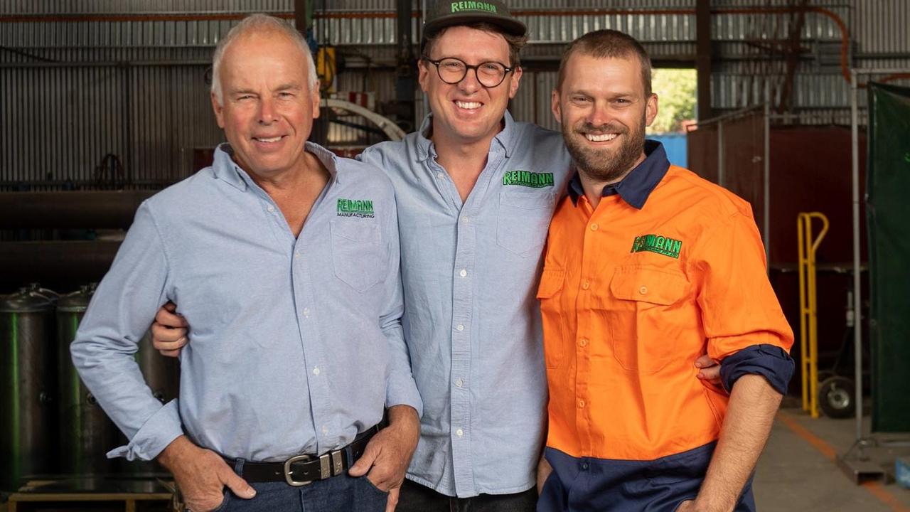 Matthew Reimann (middle) with father Michael and twin brother Stuart.