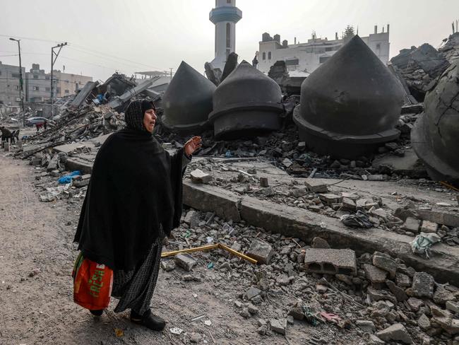 A woman walks near the Al-Faruq mosque, levelled by Israeli bombardment in Rafah in the southern Gaza Strip on February 25. Picture: Mohammed Abed/AFP