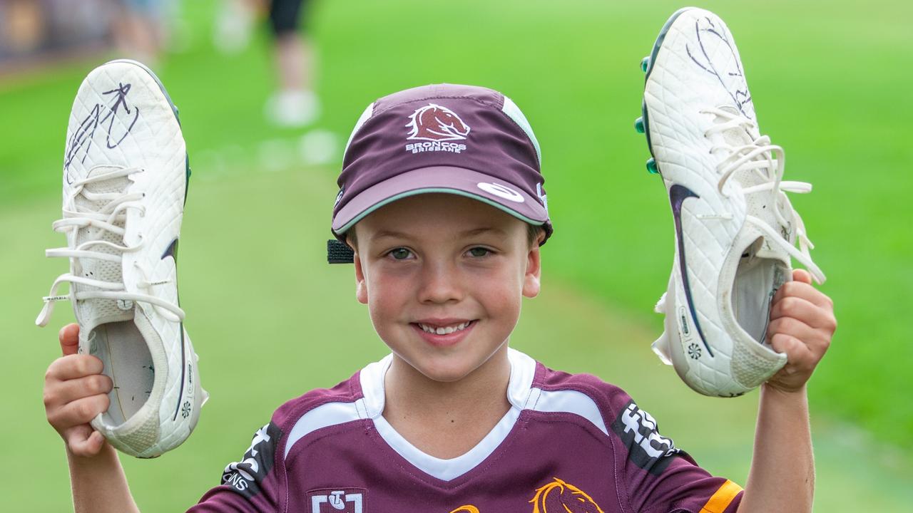 Mac Byrnes with signed boots handed over by Broncos star player Reece Walsh. Picture: David Martinelli