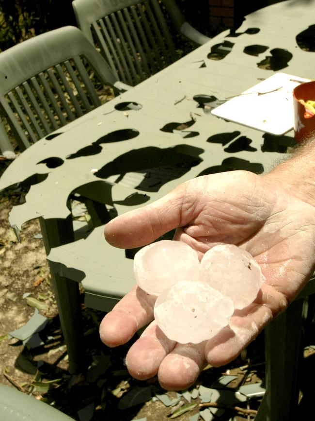 Handful of huge hailstones that damaged outdoor furniture setting in Currumbin