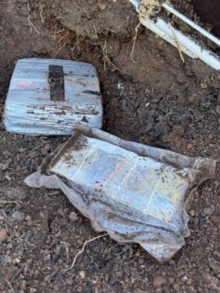 Buried cash was also uncovered during the raids across Adelaide’s north and northeast. Picture: SA Police