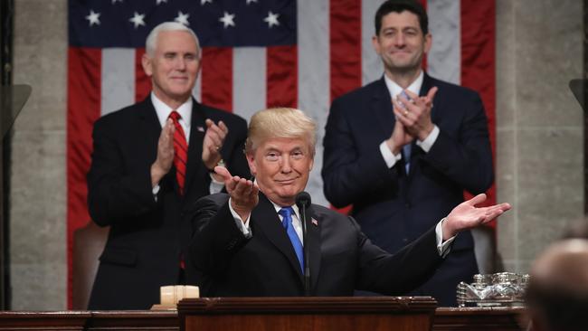 US President Donald Trump delivers the State of the Union address to the applause of Vice-President Mike Pence, left, and House Speaker Paul Ryan. Picture: Getty Images