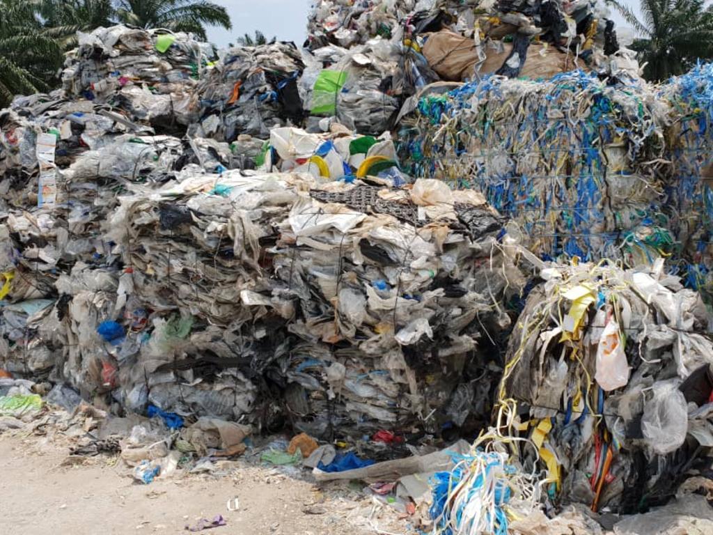 Imported plastic waste at an illegal recycling facility just outside Kuala Lumpur. Mountains of our recycling has been shipped to Vietnam, Indonesia and Malaysia for illegal dumping and burning. 