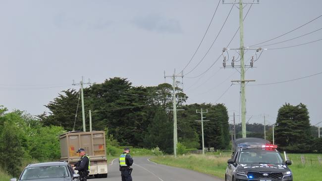 A man is being treated by paramedics after a truck rollover in Dunnstown on Monday morning.Â