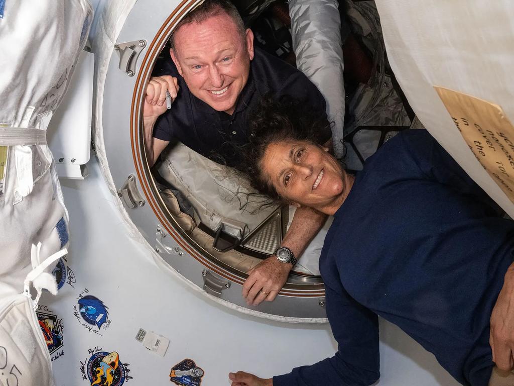 (FILES) This undated handout picture from Nasa released on July 2, 2024 shows NASAâs Boeing Crew Flight Test astronauts (from top) Butch Wilmore and Suni Williams inside the vestibule between the forward port on the International Space Stationâs Harmony module and Boeing's Starliner spacecraft. NASA needs to decide by the end of August whether to return two astronauts to Earth aboard Boeing's Starliner, which flew them to the International Space Station (ISS), or bring them home on a SpaceX craft, officials said on August 14, 2024. NASA astronauts Barry "Butch" Wilmore and Sunita "Suni" Williams blasted off for the ISS on Starliner on June 5 for what was meant to be an eight-day stay. (Photo by Handout / NASA / AFP) / RESTRICTED TO EDITORIAL USE - MANDATORY CREDIT "AFP PHOTO / NASA" - NO MARKETING NO ADVERTISING CAMPAIGNS - DISTRIBUTED AS A SERVICE TO CLIENTS