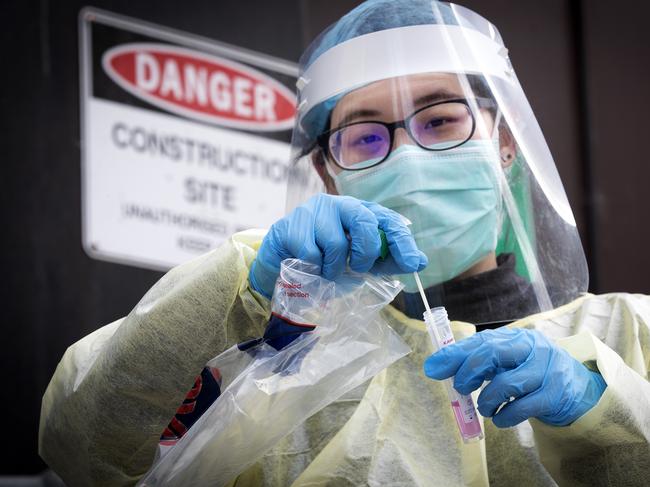 Nurse Vicky Liu prepares to test workers at a construction site at Hobart. Picture Chris Kidd