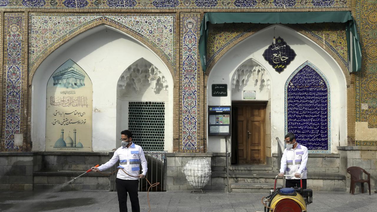 Workers disinfect the shrine of the Shiite Saint Imam Abdulazim in Tehran, Iran. Picture: AP Photo/Ebrahim Noroozi