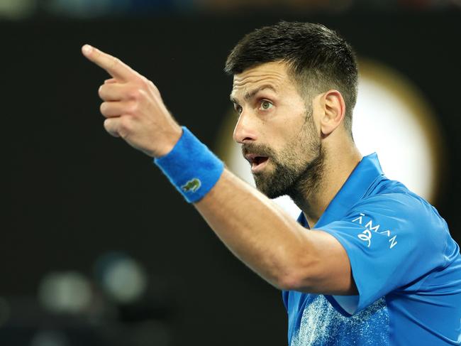 MELBOURNE, AUSTRALIA - JANUARY 17: Novak Djokovic of Serbia points as he celebrates winning match point against Tomas Machac of the Czech Republic in the Men's Singles Third Round match during day six of the 2025 Australian Open at Melbourne Park on January 17, 2025 in Melbourne, Australia. (Photo by Cameron Spencer/Getty Images)