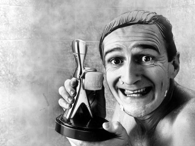 Garry McDonald in the shower with his Logie Award in 1989.