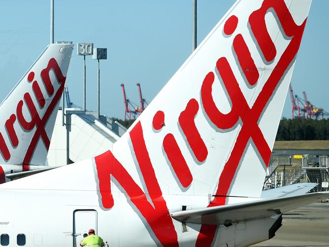 A stock image of Virgin Australia aircrafts at Brisbane Airport, Brisbane, Wednesday, August 29, 2018. Virgin Australia has today posted a full-year loss of $681 million. (AAP Image/Dan Peled) NO ARCHIVING