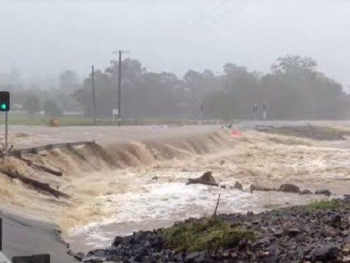 Coomera River in flood with old John Muntz Bridge.