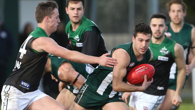 Jayden Ranno under pressure from Ryan Townsend. Picture: Hamish Blair