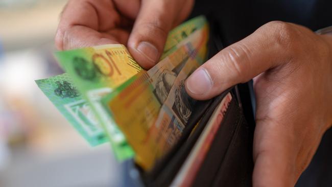 a male taking money out of the valet.  Picture: istock