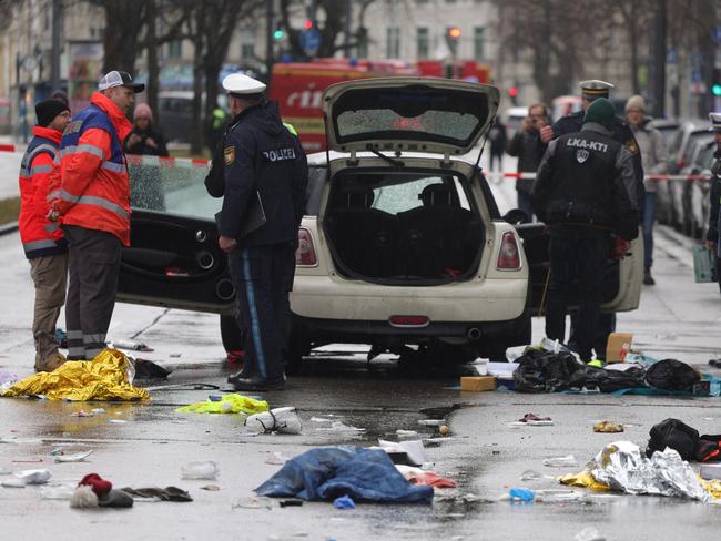 MUNICH, GERMANY - FEBRUARY 13: Police and emergency services operate near a damaged car that drove into demonstrators marching in the city center on February 13, 2025 in Munich, Germany. According to authorities, 27 people were injured, some critically. Police have detainedÃÂ theÃÂ driver. The incident comes a day before the start of the Munich Security Conference, which draws scores of foreign government officials to the city. (Photo by Johannes Simon/Getty Images)