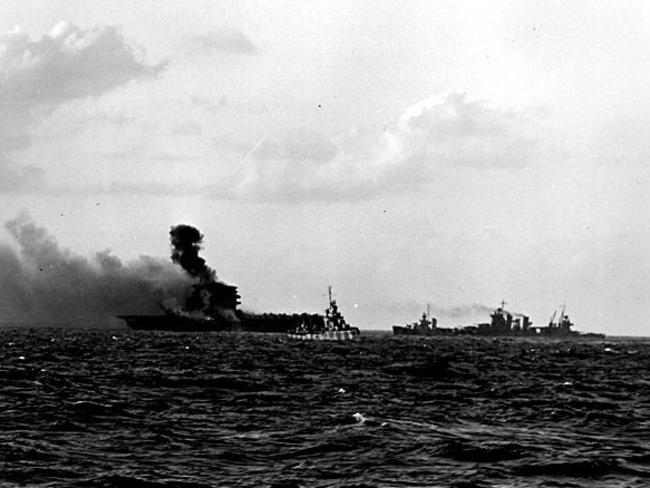 The doomed aircraft carrier USS "Lexington" burns during the Battle of Coral Sea in World War Two.