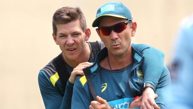 Captain Tim Paine and Langer share a moment together at a training session.