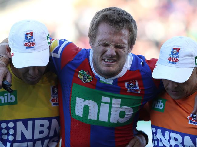 NEWCASTLE, AUSTRALIA - AUGUST 05:  Nathan Ross of the Knights is taken from the ground after getting injured during the round 22 NRL match between the Newcastle Knights and the New Zealand Warriors at McDonald Jones Stadium on August 5, 2017 in Newcastle, Australia.  (Photo by Tony Feder/Getty Images)