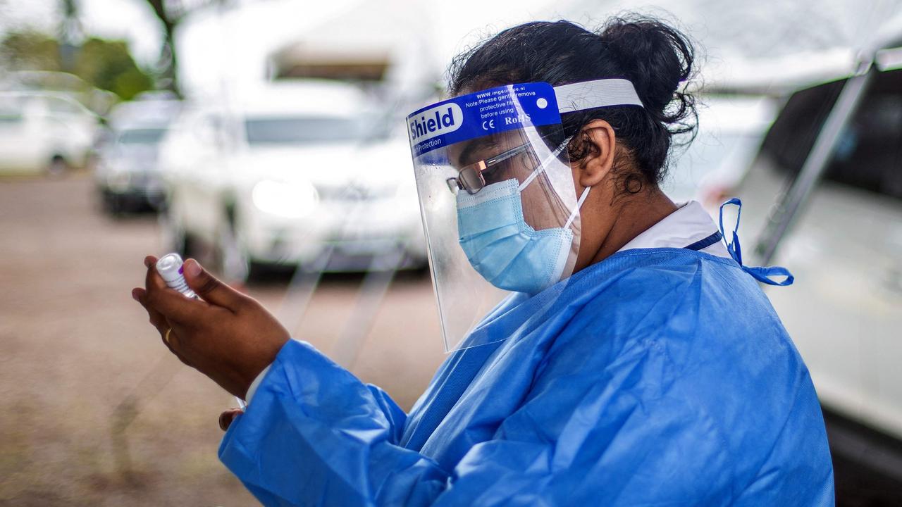 A health worker prepares a dose of AstraZeneca. Picture: Leon Lord/AFP)