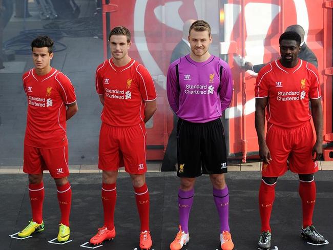 LIVERPOOL, ENGLAND - APRIL 10: (THE SUN OUT, THE SUN ON SUNDAY OUT) Philippe Coutinho, Jordan Henderson, Simon Mignolet and Kolo Toure of Liverpool present the new home kit for next season at Liverpool One on April 10, 2014 in Liverpool, England. (Photo by Andrew Powell/Liverpool FC via Getty Images) *** Local Caption *** Philippe Coutinho;Jordan Henderson;Simon Mignolet;Kolo Toure