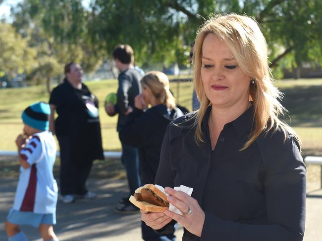 Fiona Scott enjoys a well deserved sausage sizzle.