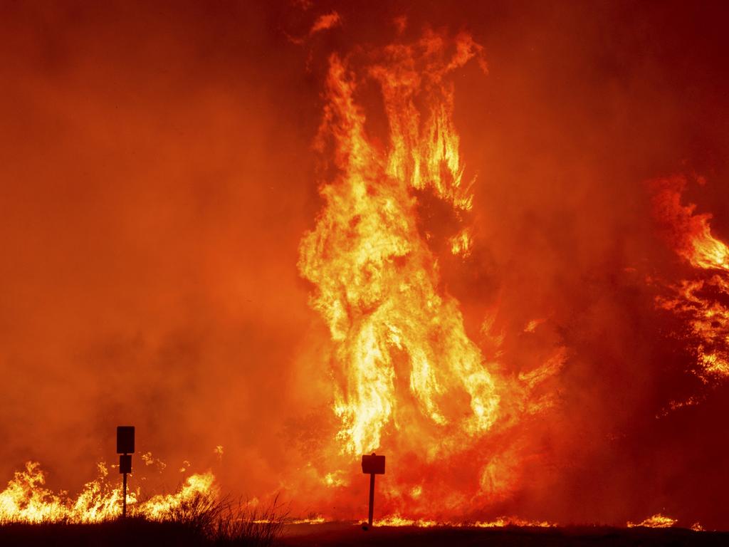 Flames by the Hughes Fire burns trees in Castaic, California. Picture: AP