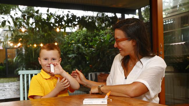 5-year-old Kindergartener Charlie Shave is helped by mum Alison Shave to take a rapid antigen test. Picture: Richard Dobson